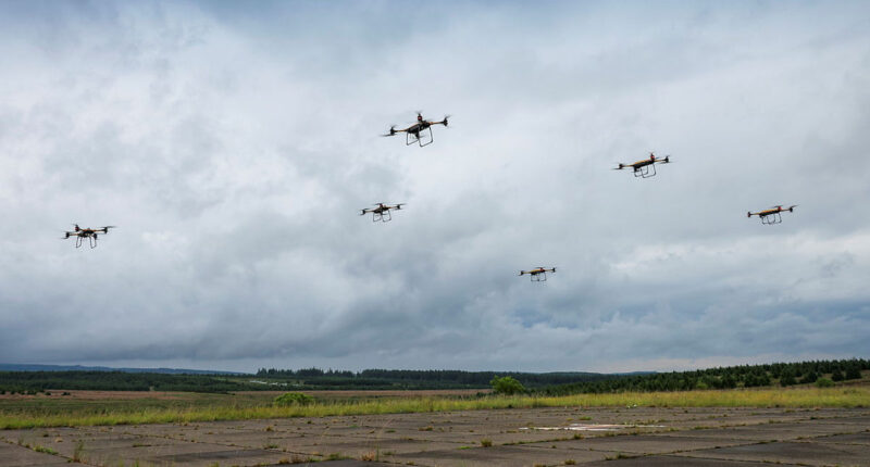 Several drones forming a swarm