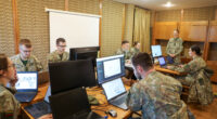 Lithuanian soldiers using computers during the Confidence 2024 exercise