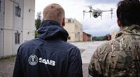 Saab personnel demonstrating the UAV trainer