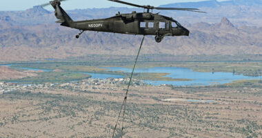 A Black Hawk helicopter demonstrating its ability to fly in autonomous mode and resupply forward forces