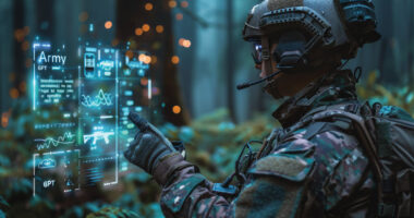 A soldier uses a handheld device to employ artificial intelligence for data analysis