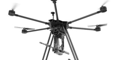 A drone equipped with the SMASH Dragon advanced robotic weapon