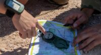 US Air Force personnel determine their location on a map at the Fort Meade Training Area