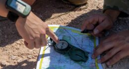 US Air Force personnel determine their location on a map at the Fort Meade Training Area