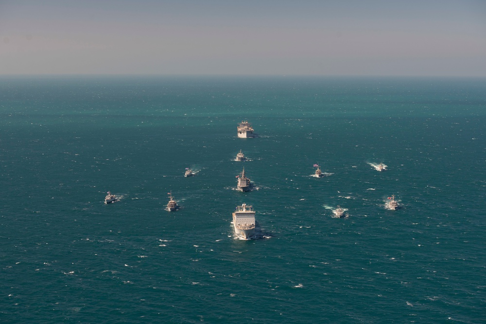 Mine countermeasures ships from the US Navy and partner nations participate in a multinational training event in the Middle East
