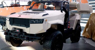 AlDeraa rapid-response system mounted on a lightweight tactical vehicle, showcasing launchers, sensors, and counter-UAS equipment at a defense exhibition