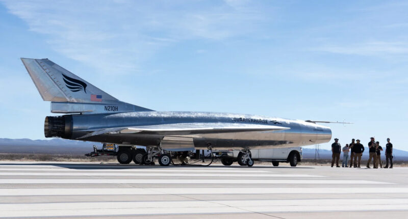 Quarterhorse unmanned test aircraft on a desert runway with ground crew, advancing development as the fastest unmanned aircraft for American warfighters