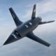 The MGI Engineering T-022 Vortex autonomous collaborative combat aircraft flying against a high-altitude blue sky, designed for UK manned-unmanned teaming operations.